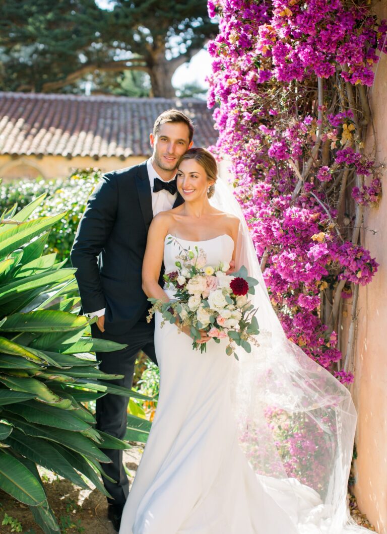 a man and woman posing for a picture smiling